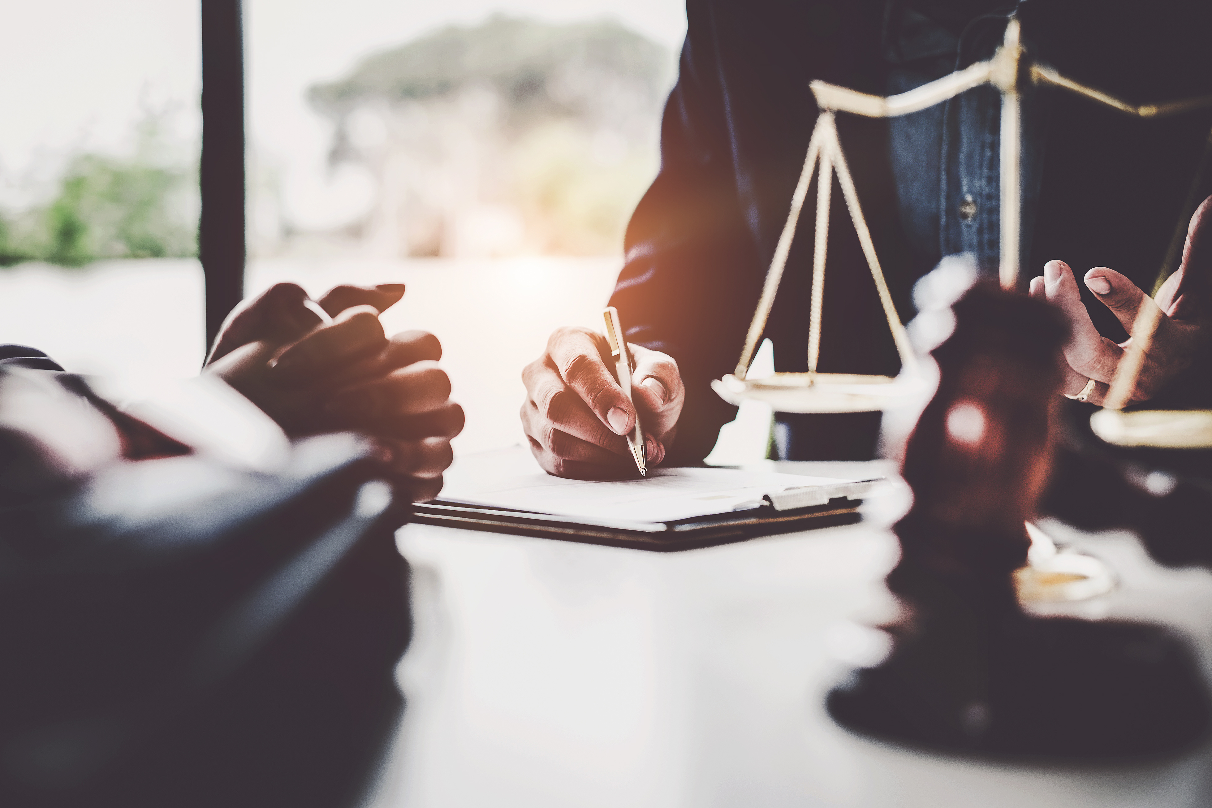 Lawyer and guardian discussing a student